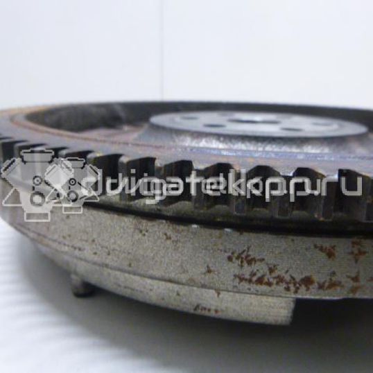 Фото Маховик для двигателя K12B для Suzuki / Mitsubishi / Vauxhall 86-94 л.с 16V 1.2 л бензин 1262051K00